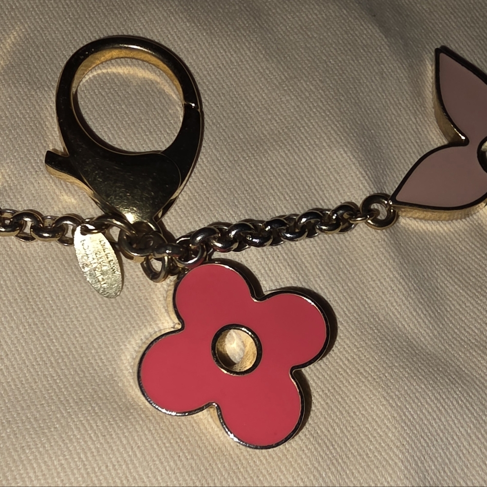 Authentic Louis Vuitton Floral Pink and Gold Key Holder a solid pink color - Picture 16 of 16